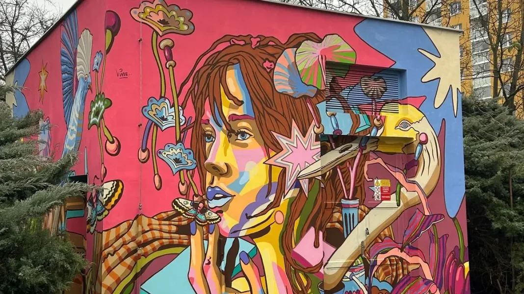 French Artist Paints Dreamy Girl with Flowers and Heron on Prague Substation